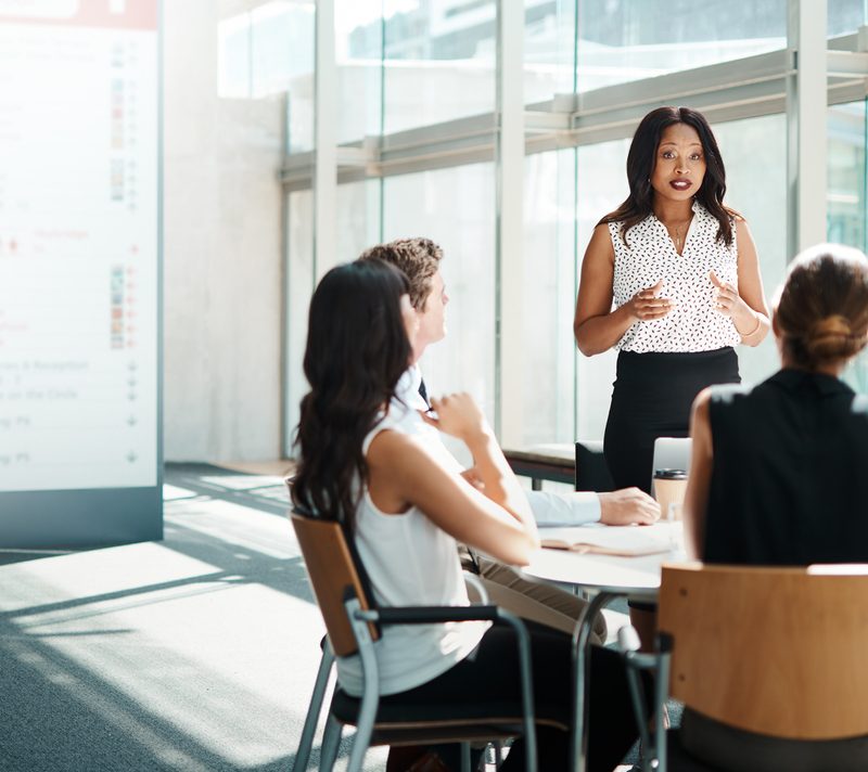 Businesspeople having a meeting to maintain positive communication between the team.