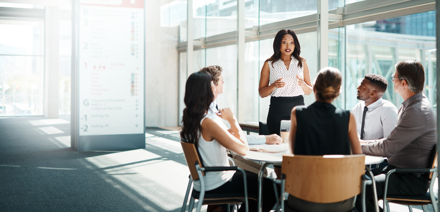 Businesspeople having a meeting to maintain positive communication between the team.