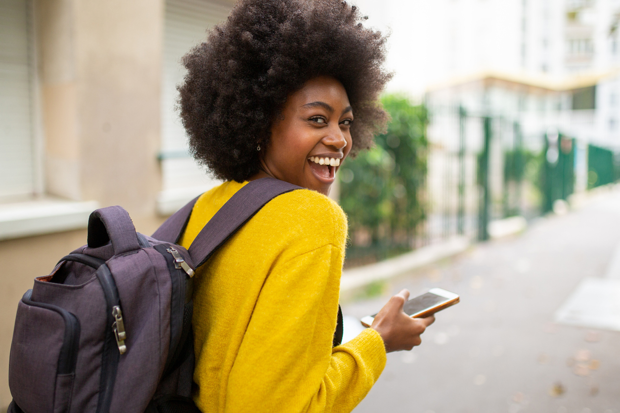 laughing-woman-wearing-backpack